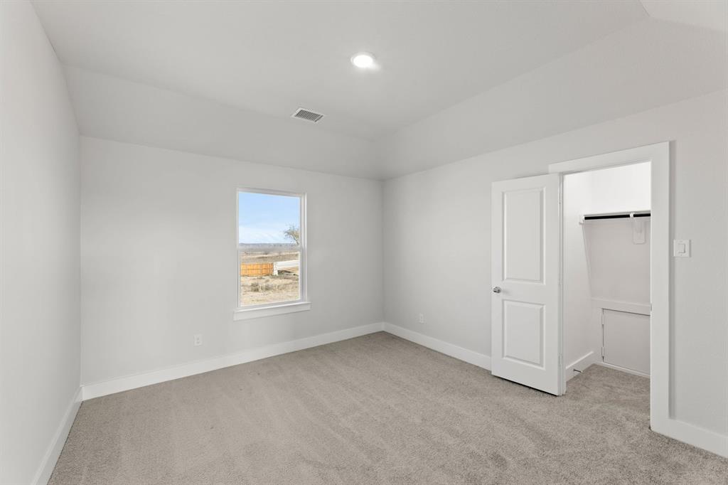 1504 Blackthorne Lane Krum, TX 76249 - Photo 23 of 30 an empty room with windows and closet