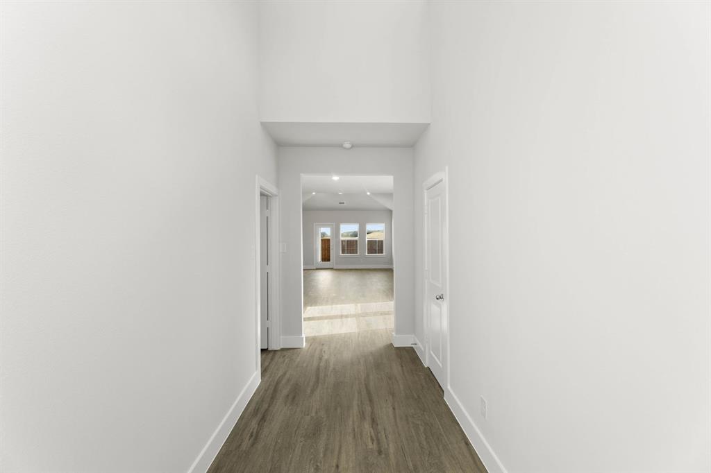 1504 Blackthorne Lane Krum, TX 76249 - Photo 4 of 30 a view of a hallway with wooden floor