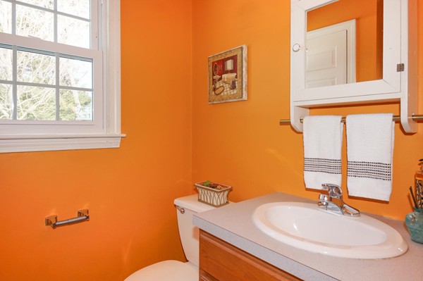 237 Holt Road Andover, MA 01810 - Photo 12 of 27 a bathroom with a sink a toilet and a mirror