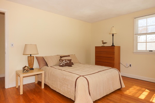 237 Holt Road Andover, MA 01810 - Photo 14 of 27 a bedroom with a bed and a table