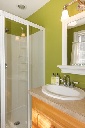 237 Holt Road Andover, MA 01810 - Photo 15 of 27 a bathroom with a granite countertop sink and a mirror