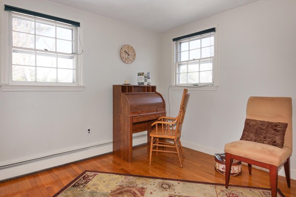 237 Holt Road Andover, MA 01810 - Photo 18 of 27 a chair and a table in a room