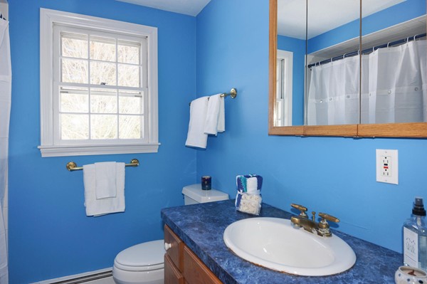 237 Holt Road Andover, MA 01810 - Photo 19 of 27 a bathroom with a sink toilet and mirror