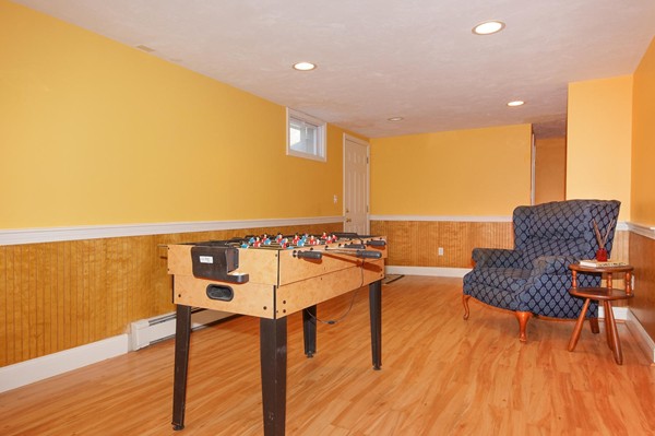 237 Holt Road Andover, MA 01810 - Photo 21 of 27 a living room with furniture and a wooden floor