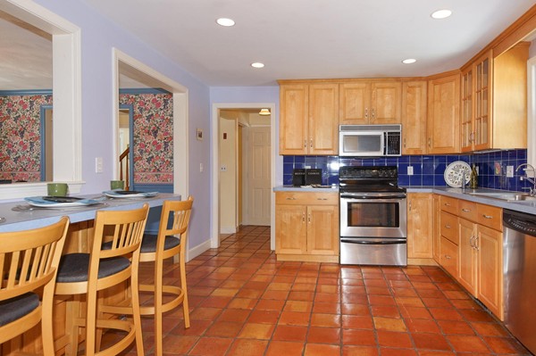 237 Holt Road Andover, MA 01810 - Photo 6 of 27 a kitchen with stainless steel appliances a stove a sink and a refrigerator