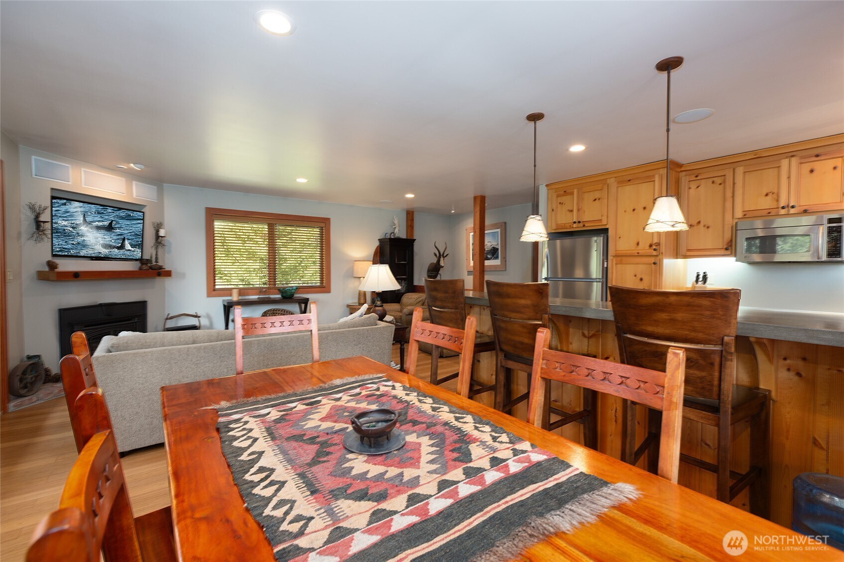 128 White Point Road Friday Harbor, WA 98250 - Photo 24 of 40 a large kitchen with stainless steel appliances granite countertop a stove a sink dishwasher a dining table and chair with wooden floor