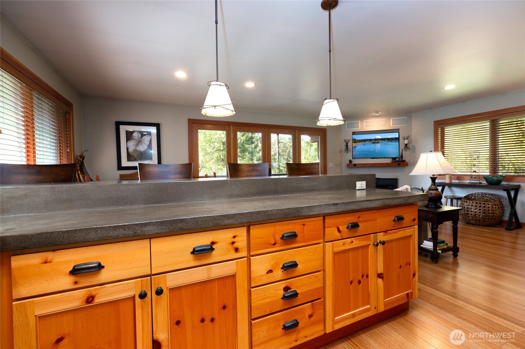 128 White Point Road Friday Harbor, WA 98250 - Photo 27 of 40 a large kitchen with kitchen island granite countertop a stove a sink a window and dining table