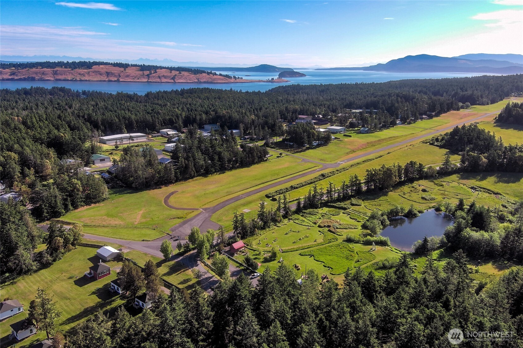 128 White Point Road Friday Harbor, WA 98250 - Photo 40 of 40 a view of a city with mountains in the background
