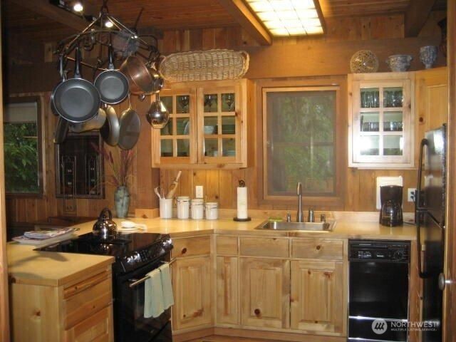 128 White Point Road Friday Harbor, WA 98250 - Photo 8 of 40 a kitchen with a sink and a stove top oven