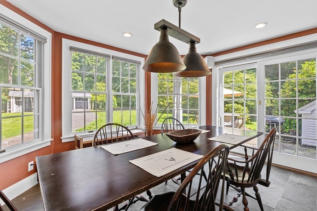 913 Salem End Road Framingham, MA 01702 - Photo 11 of 42 a view of a dining room with furniture window and outside view