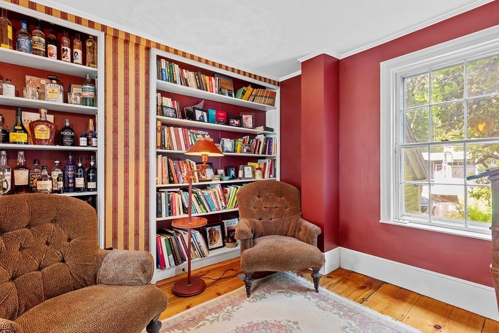 913 Salem End Road Framingham, MA 01702 - Photo 17 of 42 a living room with furniture and a book shelf
