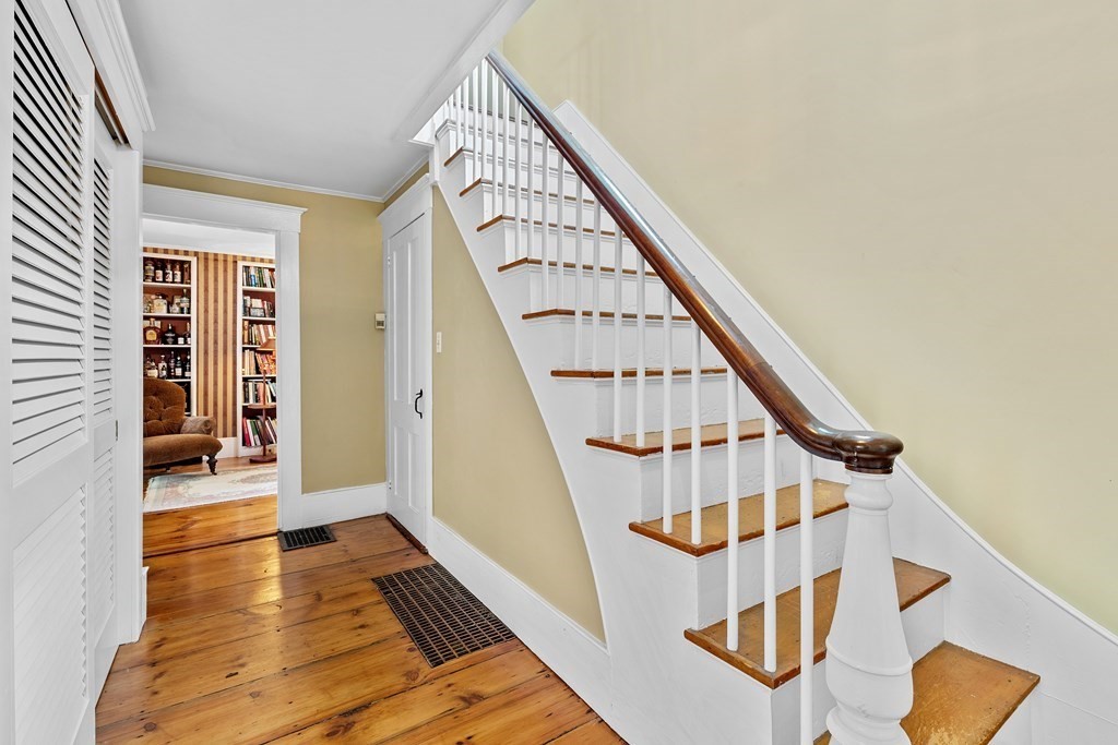 913 Salem End Road Framingham, MA 01702 - Photo 23 of 42 a view of staircase with white walls and wooden floor