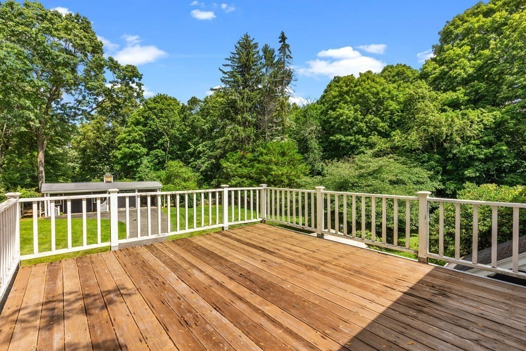 913 Salem End Road Framingham, MA 01702 - Photo 32 of 42 a balcony with wooden floor and fence