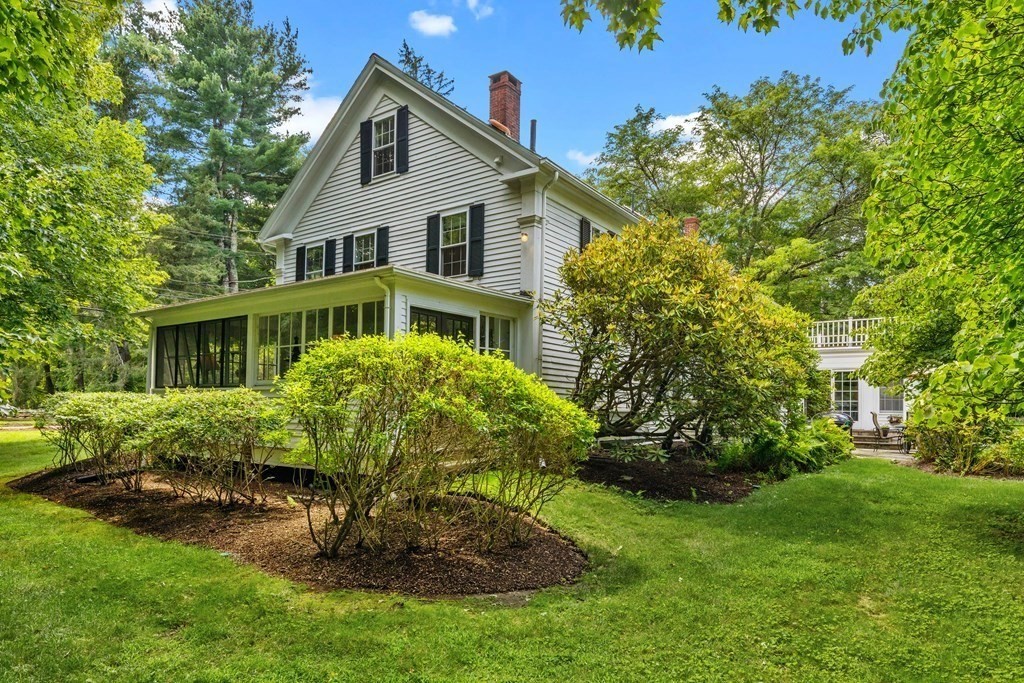 913 Salem End Road Framingham, MA 01702 - Photo 40 of 42 a front view of a house with garden