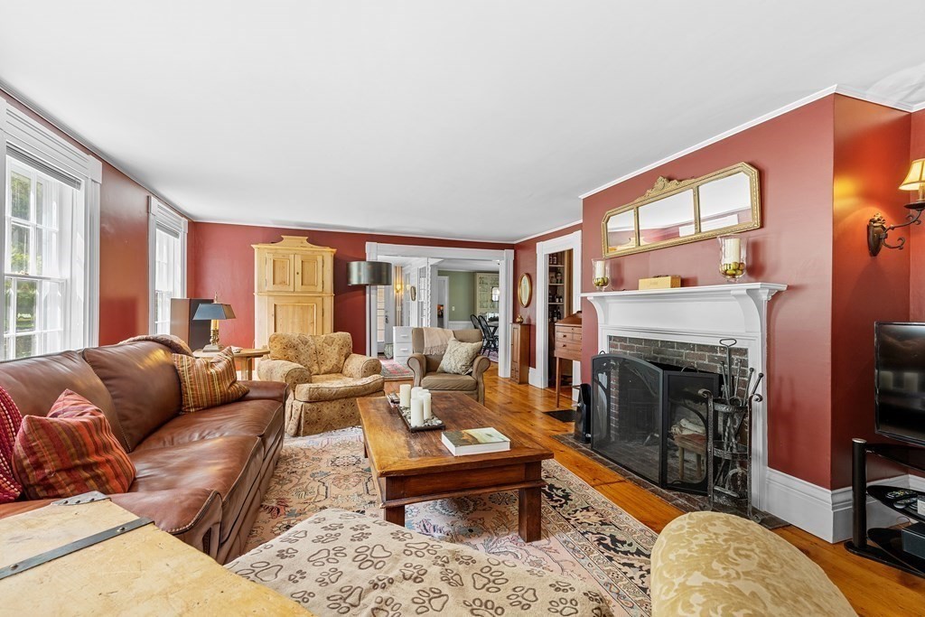 913 Salem End Road Framingham, MA 01702 - Photo 4 of 42 a living room with furniture fireplace and a table