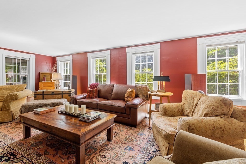 913 Salem End Road Framingham, MA 01702 - Photo 5 of 42 a living room with furniture a large window and a table