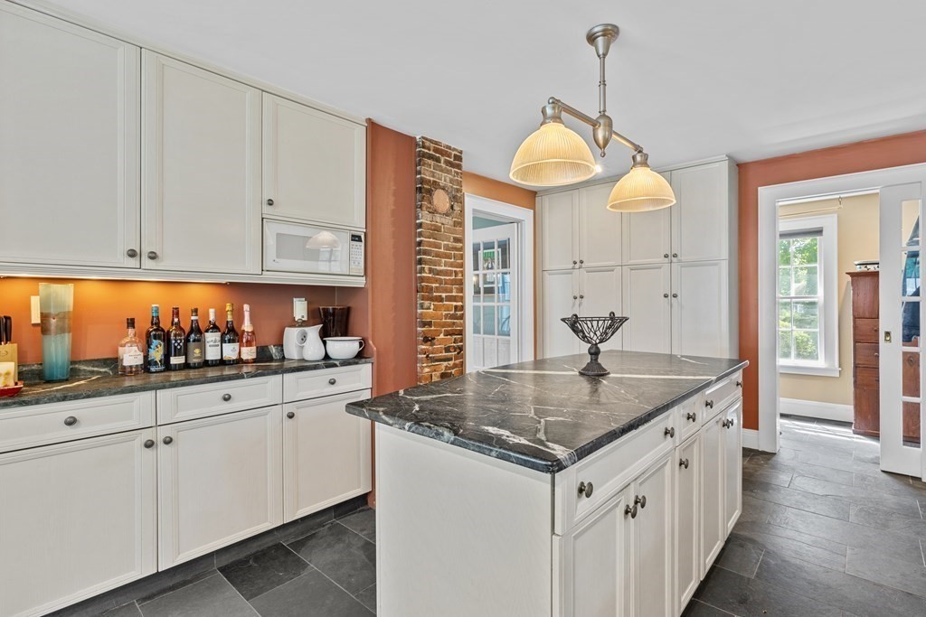 913 Salem End Road Framingham, MA 01702 - Photo 9 of 42 a kitchen with stainless steel appliances granite countertop a sink a stove and a white cabinets