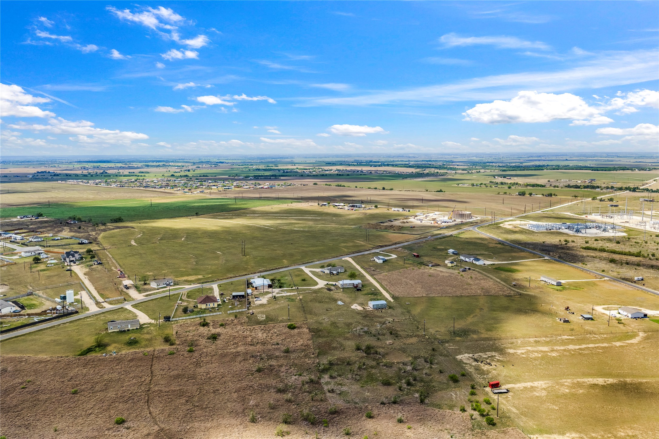 5101 County Road 463 Elgin, TX 78621 - Photo 5 of 38 Conveniently situated just 14 miles from the future Samsung plant in Taylor and within easy reach of Austin, Tesla, Amazon, and the airport, it combines peaceful country living with unbeatable access to major growth and employment hubs making it a true investor’s dream.