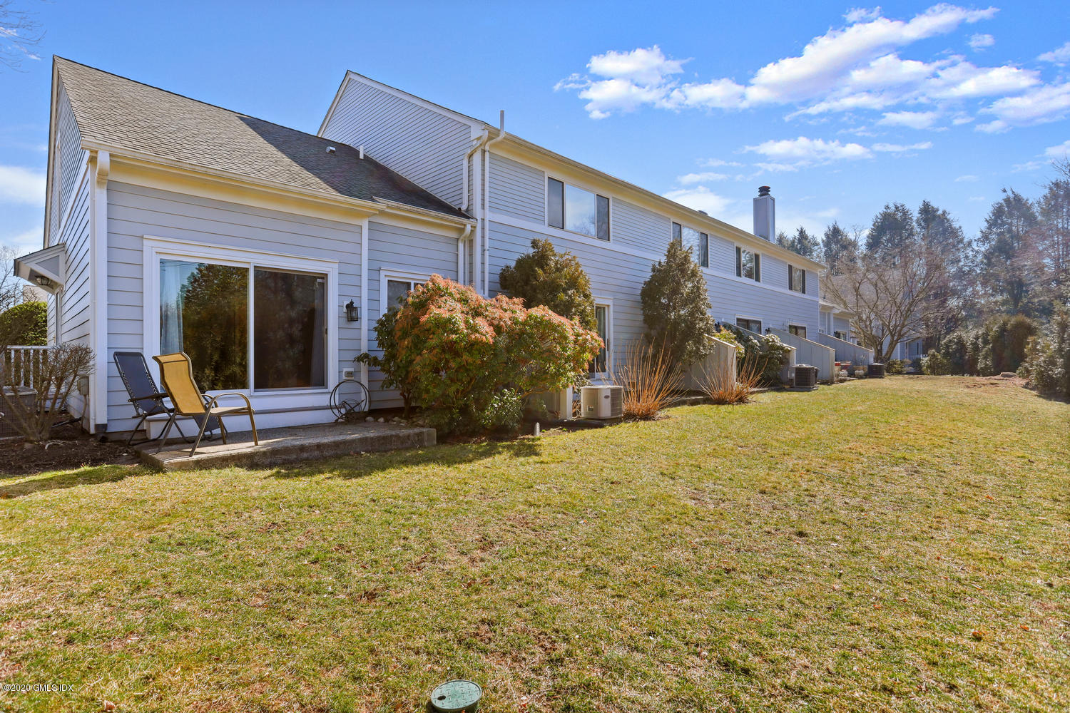 19 Whiffletree Way, Unit 19 Riverside, CT 06878 - Photo 15 of 32 a view of a house with a yard and garage