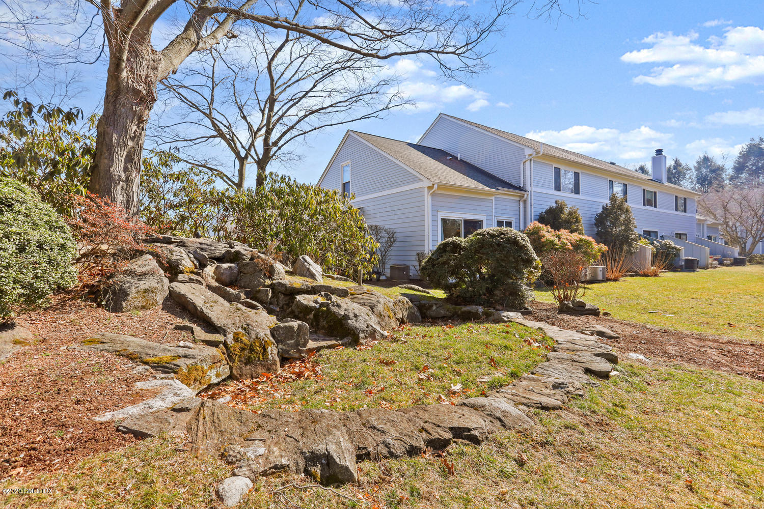 19 Whiffletree Way, Unit 19 Riverside, CT 06878 - Photo 17 of 32 a view of a yard with a house