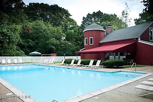 19 Whiffletree Way, Unit 19 Riverside, CT 06878 - Photo 18 of 32 a view of a swimming pool with a patio