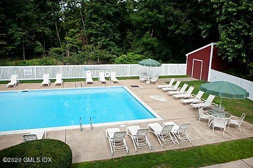 19 Whiffletree Way, Unit 19 Riverside, CT 06878 - Photo 19 of 32 a view of a chairs and table in the patio