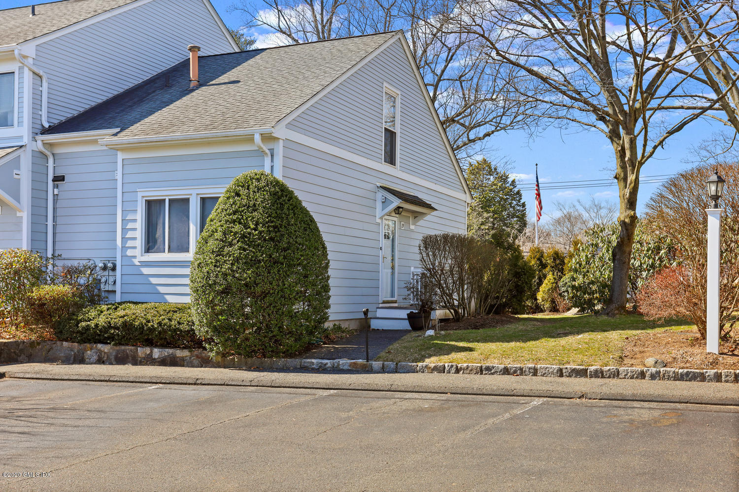 19 Whiffletree Way, Unit 19 Riverside, CT 06878 - Photo 2 of 32 front view of a house with a yard