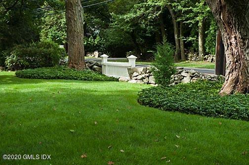 19 Whiffletree Way, Unit 19 Riverside, CT 06878 - Photo 28 of 32 a view of a house with a backyard