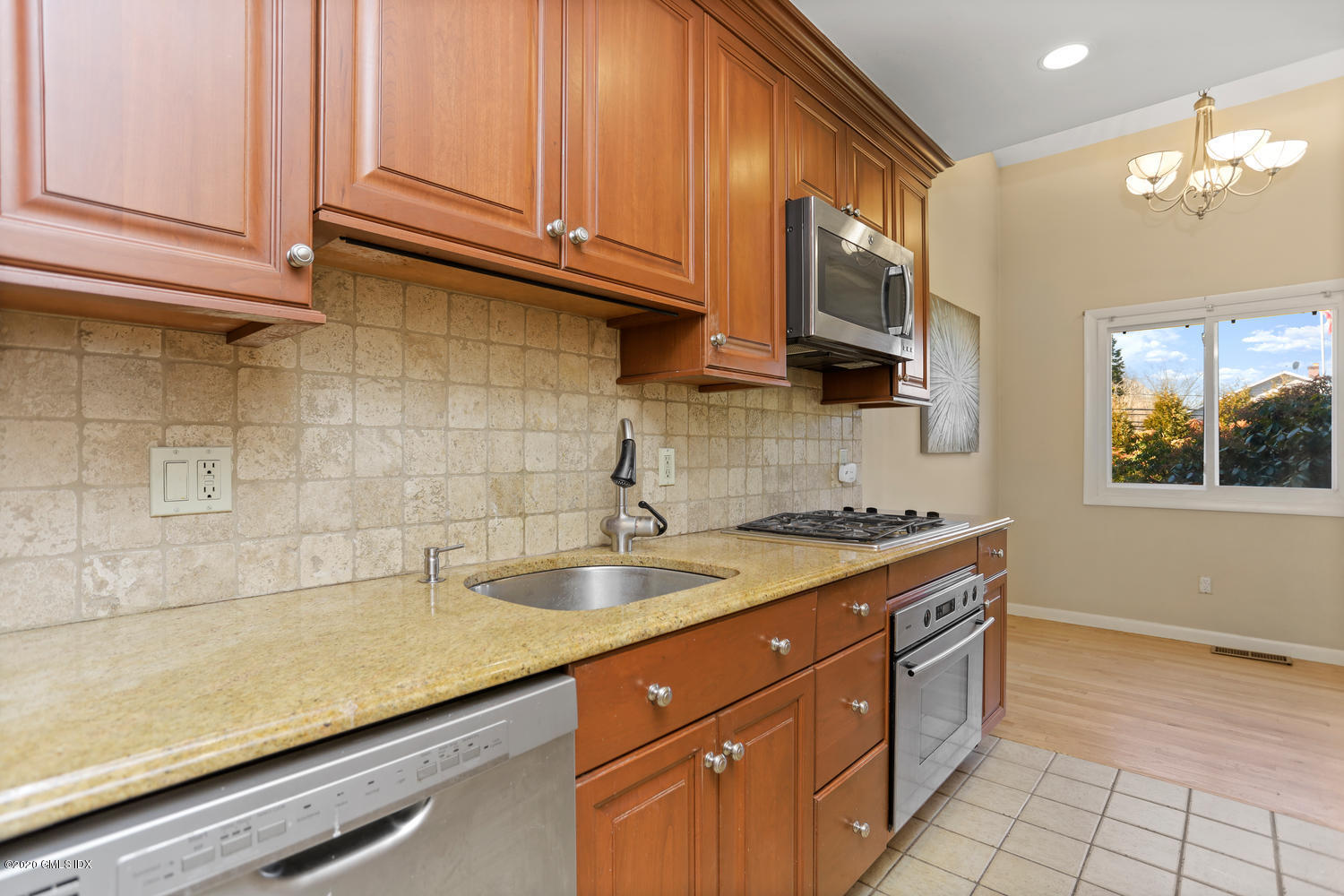 19 Whiffletree Way, Unit 19 Riverside, CT 06878 - Photo 8 of 32 a kitchen with a sink and cabinets