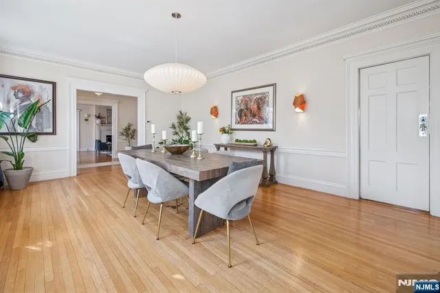 a dining room with wooden floor and breakfast area