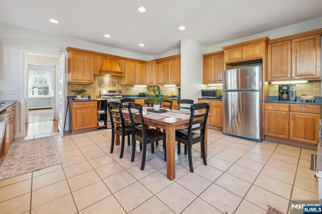 258 Ridgewood Avenue Glen Ridge, NJ 07028 - Photo 14 of 44 a kitchen with stainless steel appliances granite countertop a refrigerator and a stove top oven