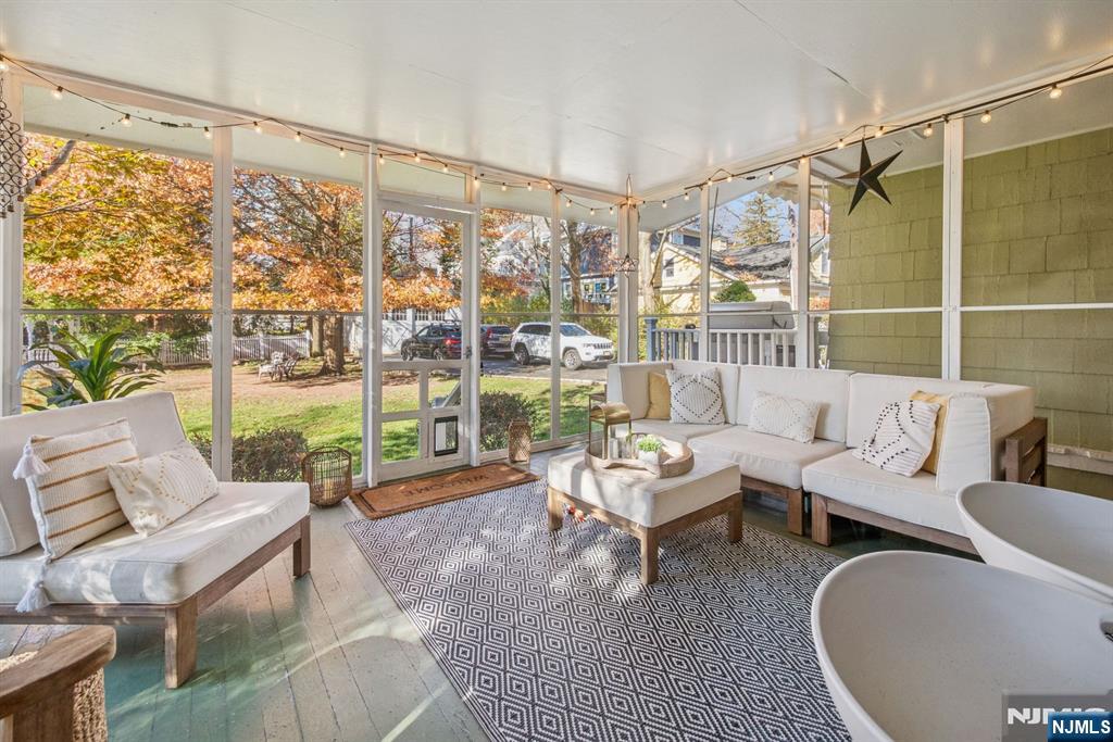 258 Ridgewood Avenue Glen Ridge, NJ 07028 - Photo 17 of 44 a living room with furniture and a floor to ceiling window