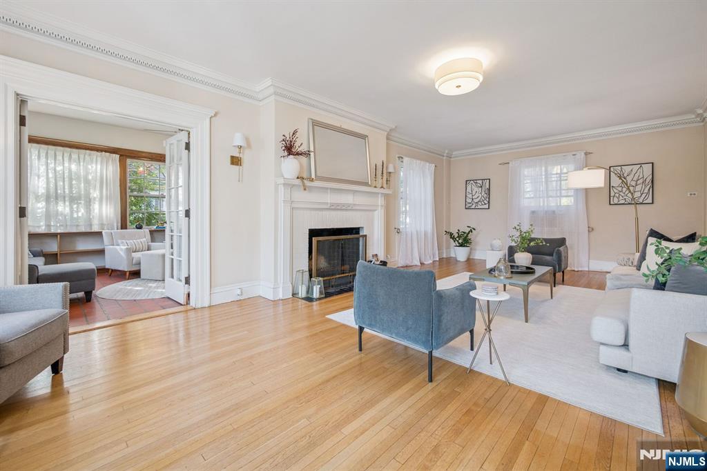258 Ridgewood Avenue Glen Ridge, NJ 07028 - Photo 7 of 44 a living room with furniture and a fireplace