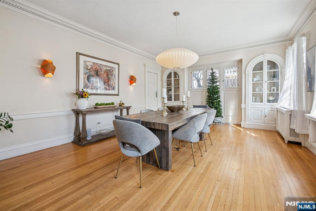 258 Ridgewood Avenue Glen Ridge, NJ 07028 - Photo 10 of 44 a view of a dining room with furniture window and wooden floor