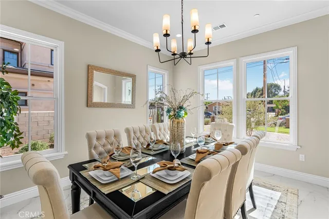 a kitchen with stainless steel appliances a sink stove and cabinets