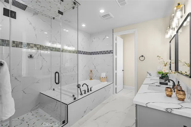 a bathroom with a double vanity sink mirror and double