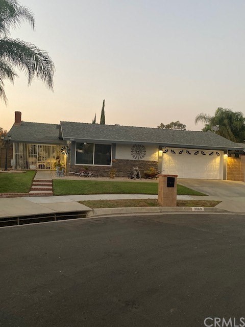 3069 Irving Street Riverside, CA 92504 - Photo 1 of 1 a front view of a house with a ocean view
