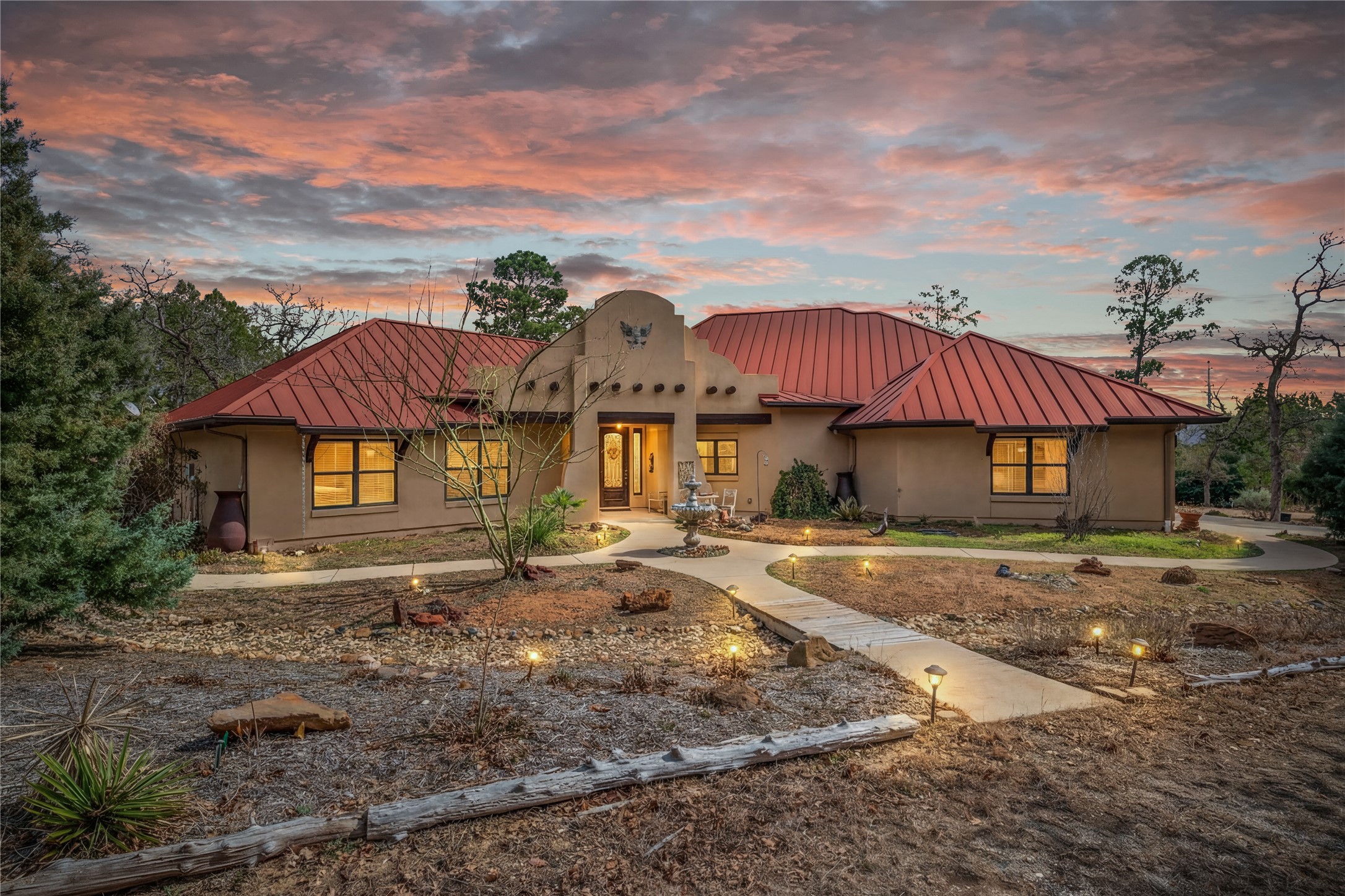 Set on 3.9 pine-covered acres in Bastrop’s popular Circle D community, this artisan Spanish Hacienda is a rare blend of craftsmanship, color, and calm.