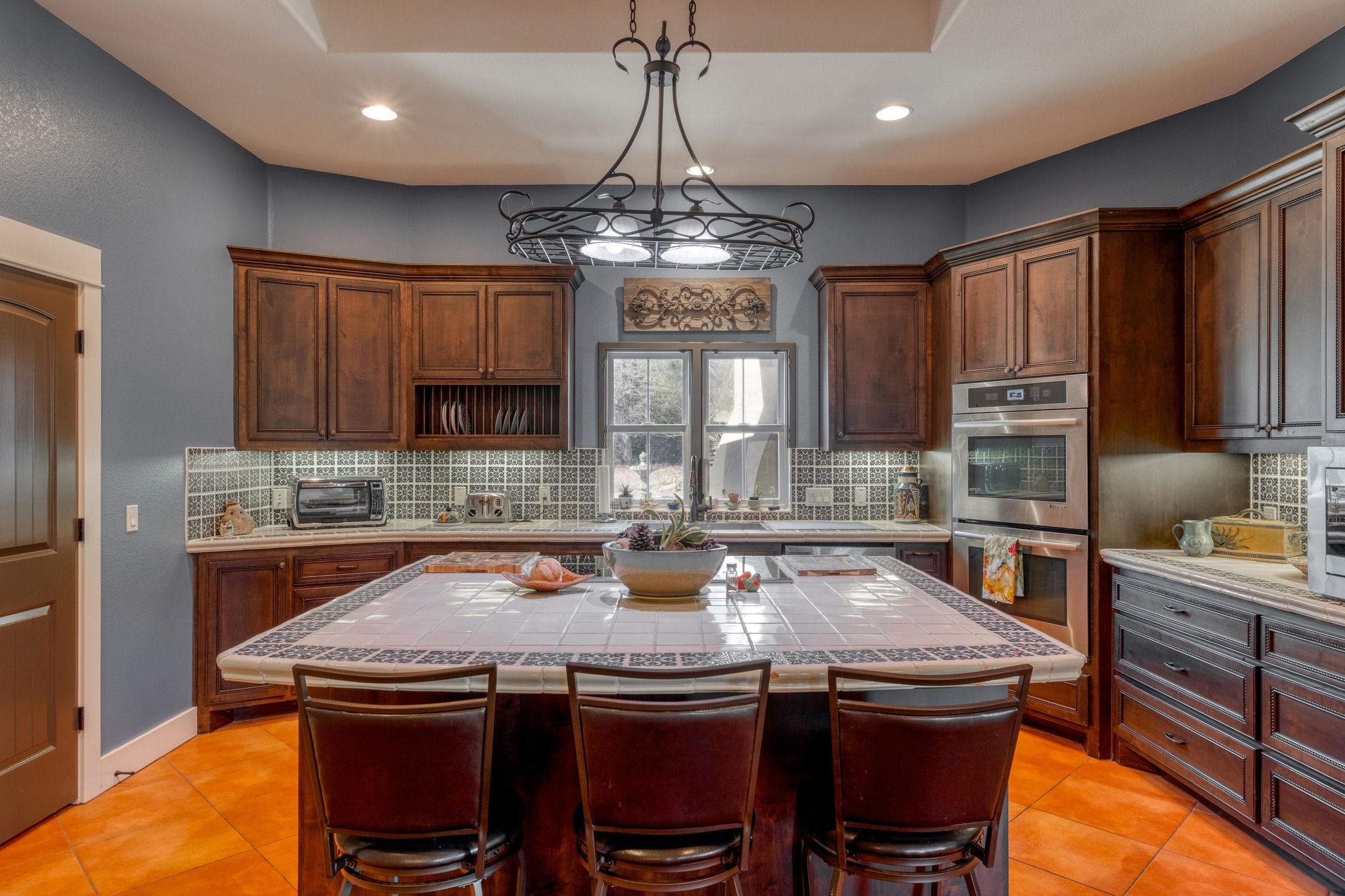 129 Painted Post Bastrop, TX 78602 - Photo 19 of 40 a kitchen with a stove a sink and chandelier