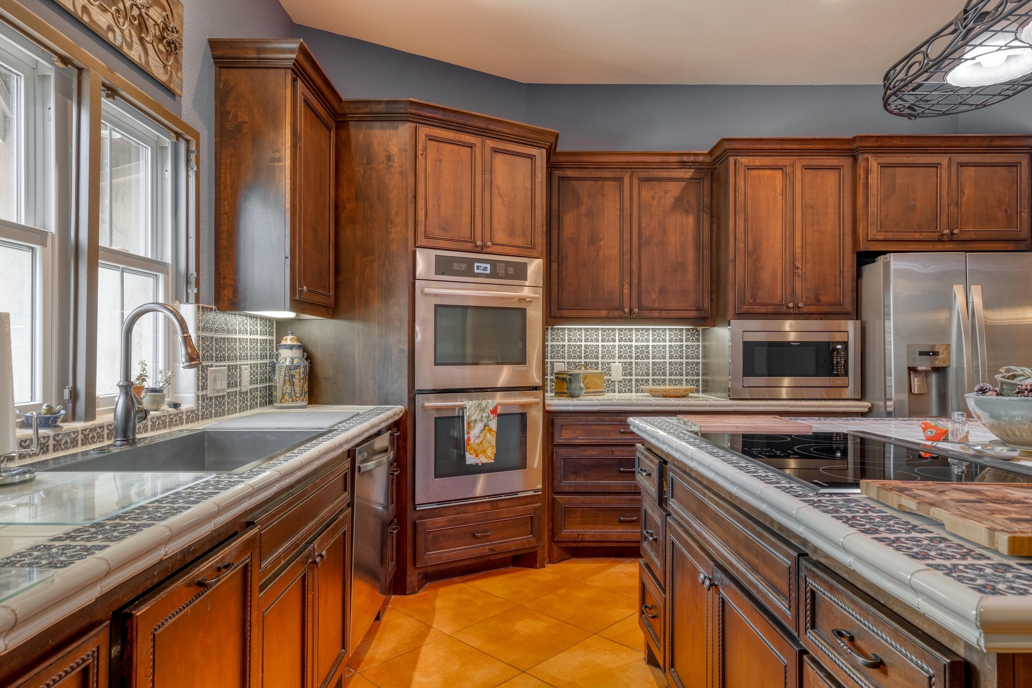 129 Painted Post Bastrop, TX 78602 - Photo 21 of 40 a kitchen with granite countertop a sink stove and cabinets