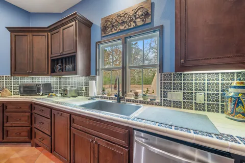 a kitchen with a sink and a window