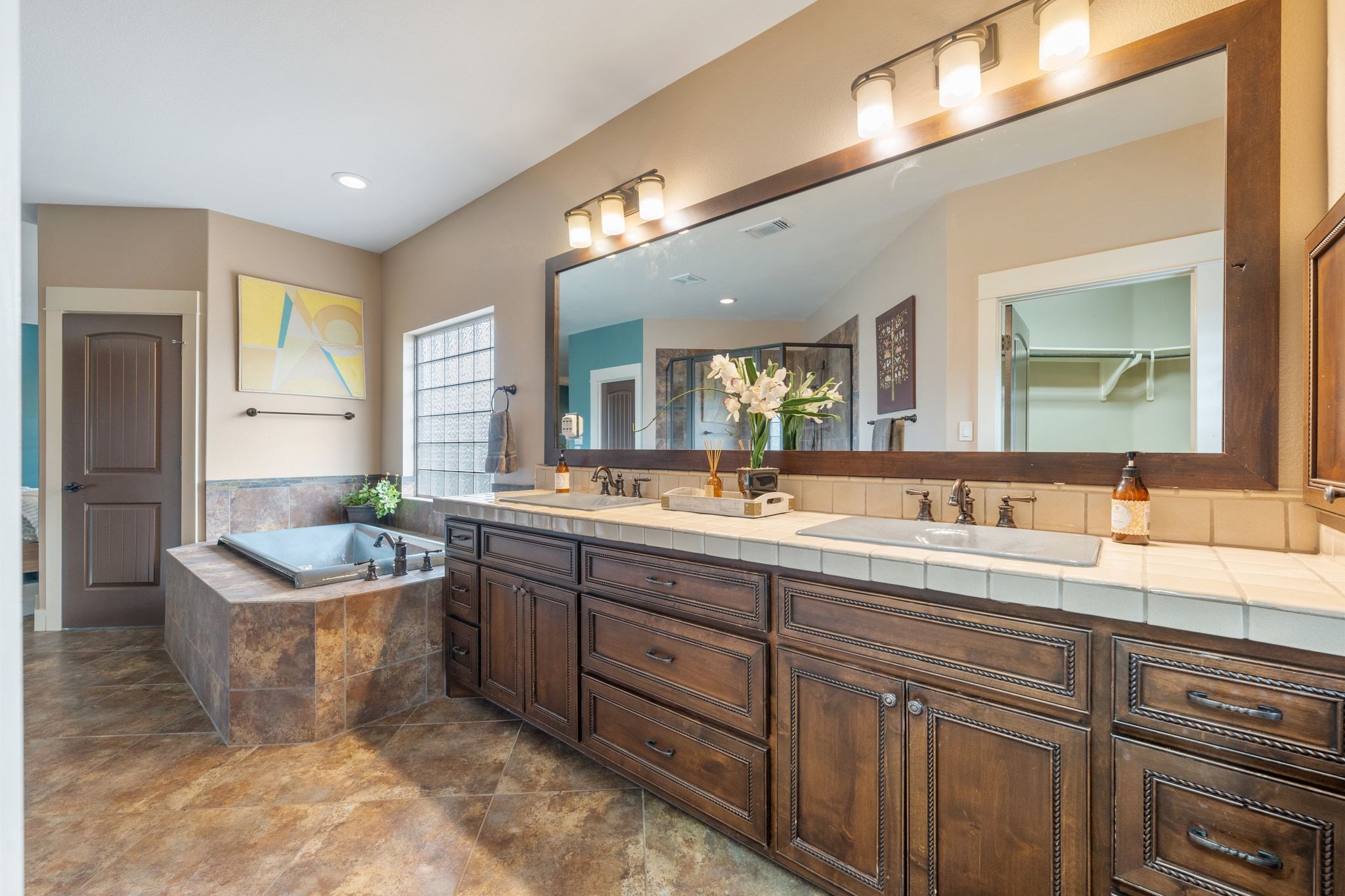 129 Painted Post Bastrop, TX 78602 - Photo 24 of 40 An expansive dual vanity comes with timeless custom cabinetry and tastefully selected fixtures and hardware.