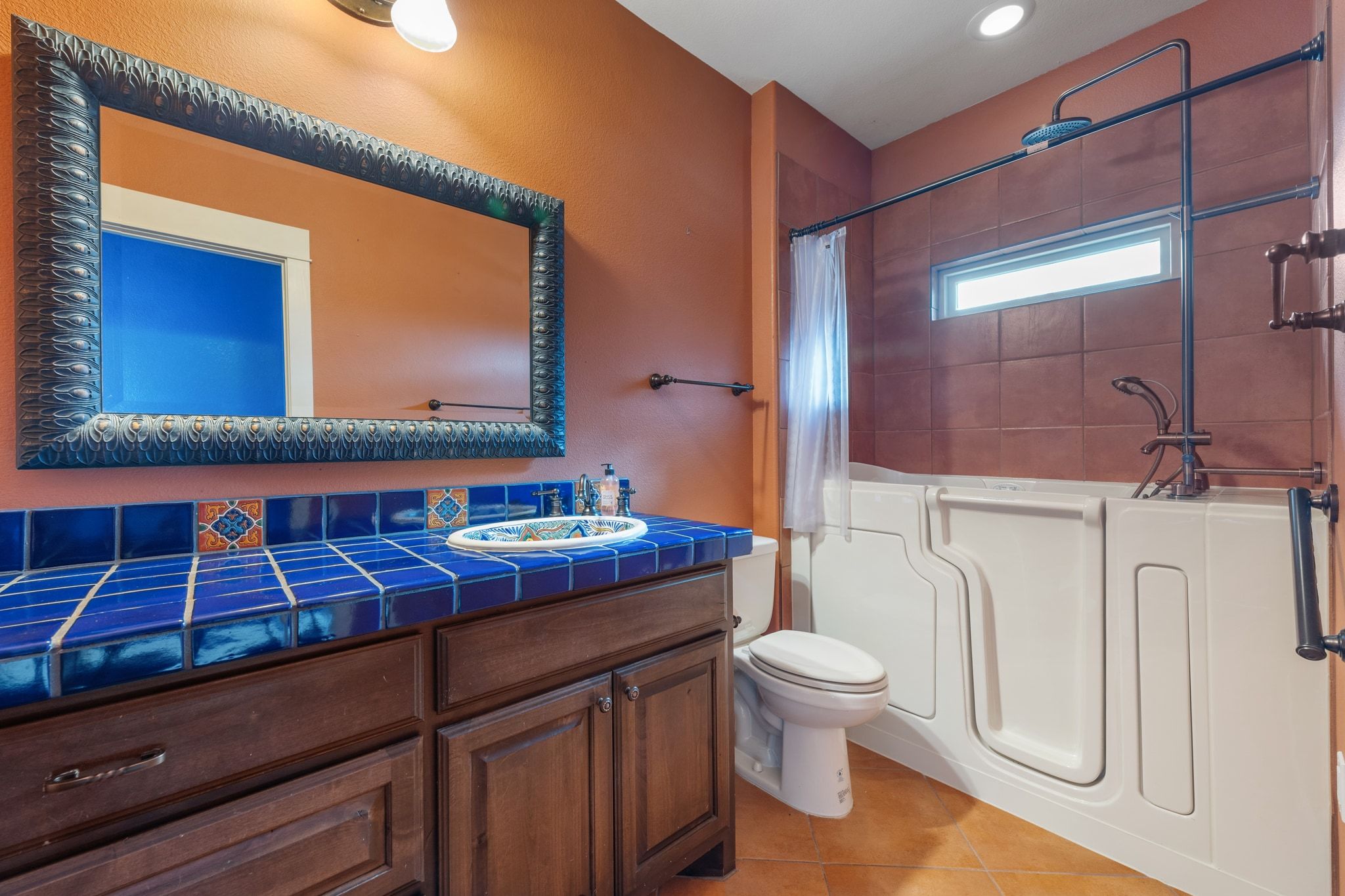 129 Painted Post Bastrop, TX 78602 - Photo 27 of 40 The private ensuite bath for the guest room comes with a colorful tiled vanity and a Safetstep soaker tub ($20K addition).