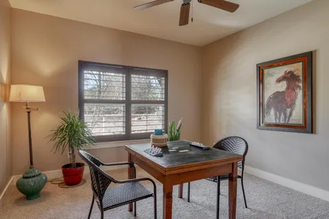 a view of a livingroom with furniture and window