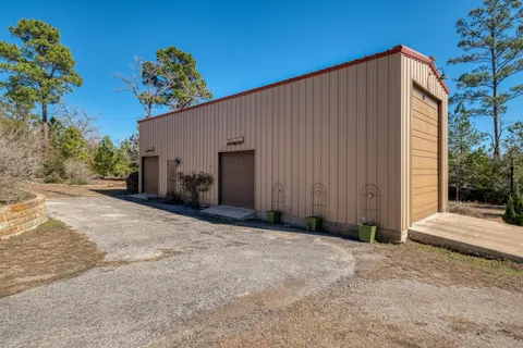 a view of potted plants in front of house
