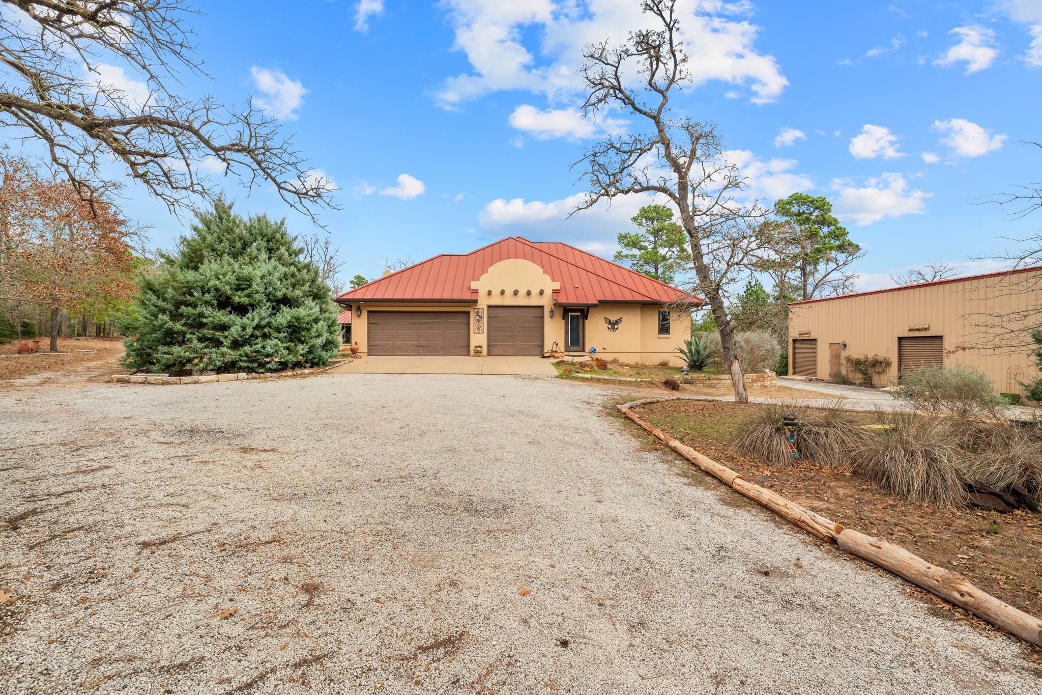 129 Painted Post Bastrop, TX 78602 - Photo 37 of 40 The front drive and attached three car garage provide plenty of space for parking, and more.