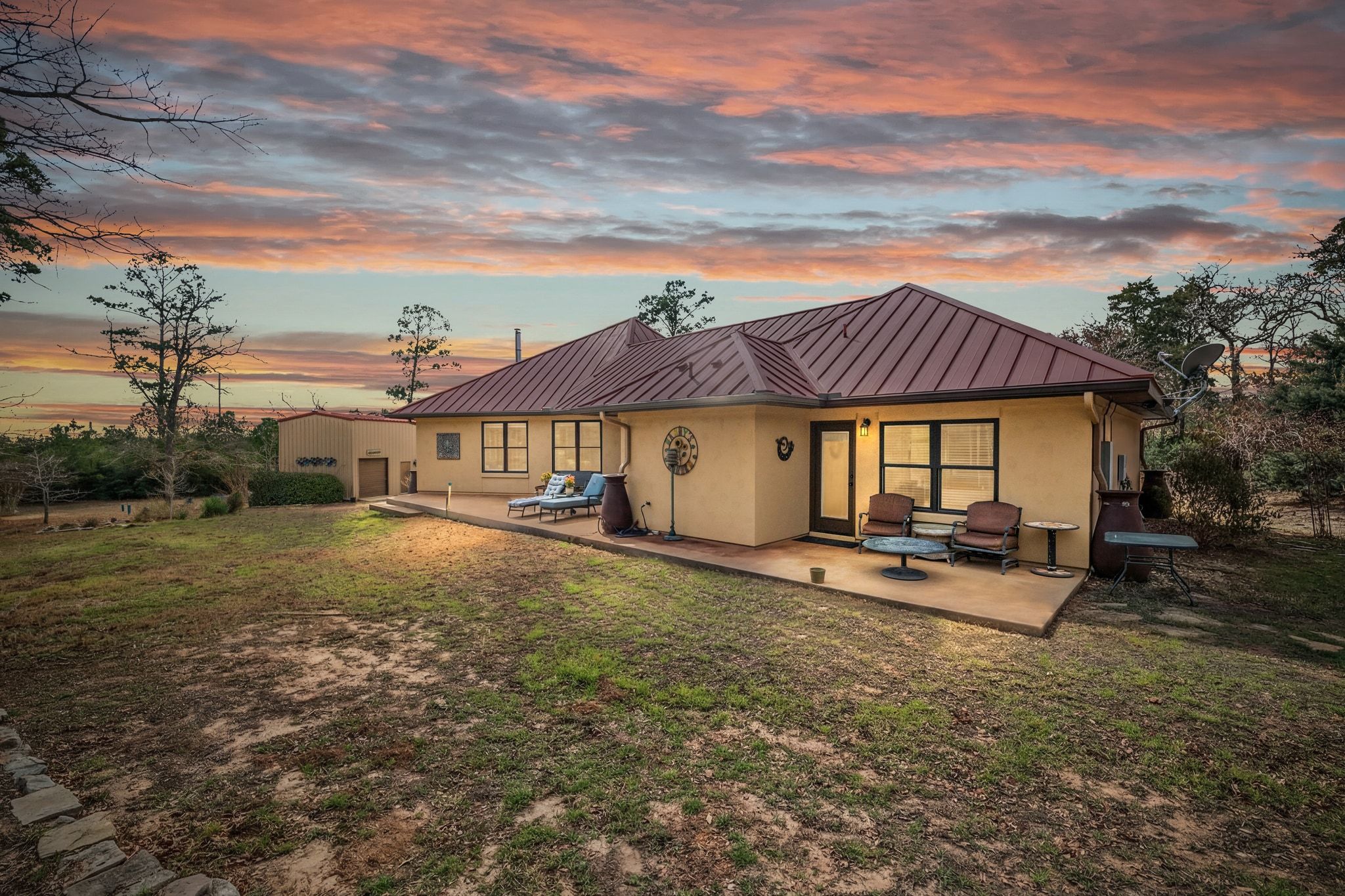 129 Painted Post Bastrop, TX 78602 - Photo 5 of 40 a view of a big house with table and chairs in front of it