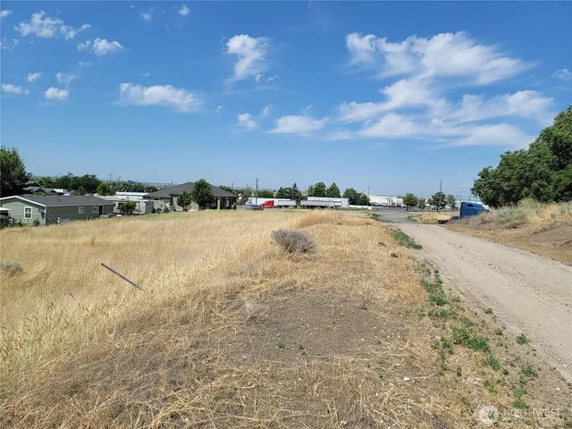 a view of an ocean beach and city