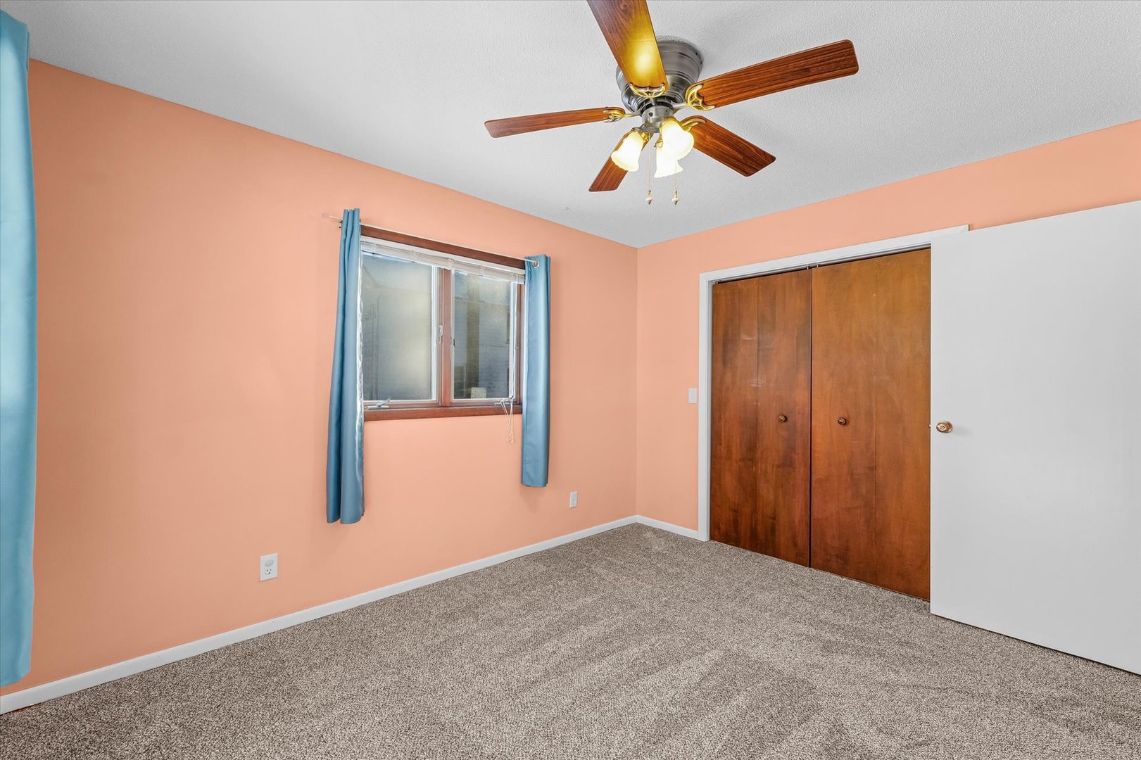 211 North Center Street Melvin, IL 60952 - Photo 15 of 26 an empty room with closet and fan