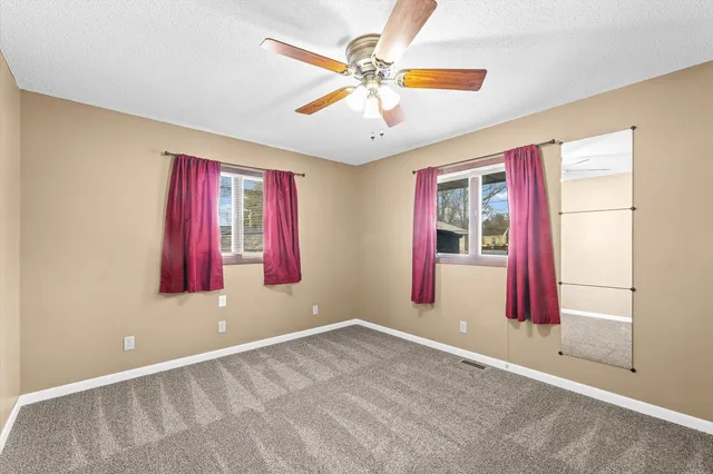 wooden floor and window in an empty room